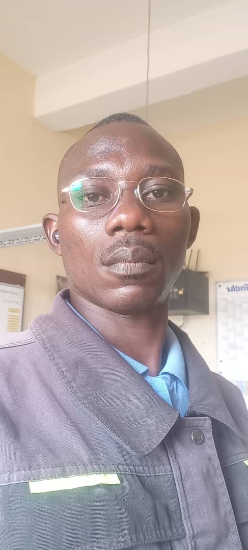 Portrait of GTGAS AUTOMOBILE lead technician in workshop uniform