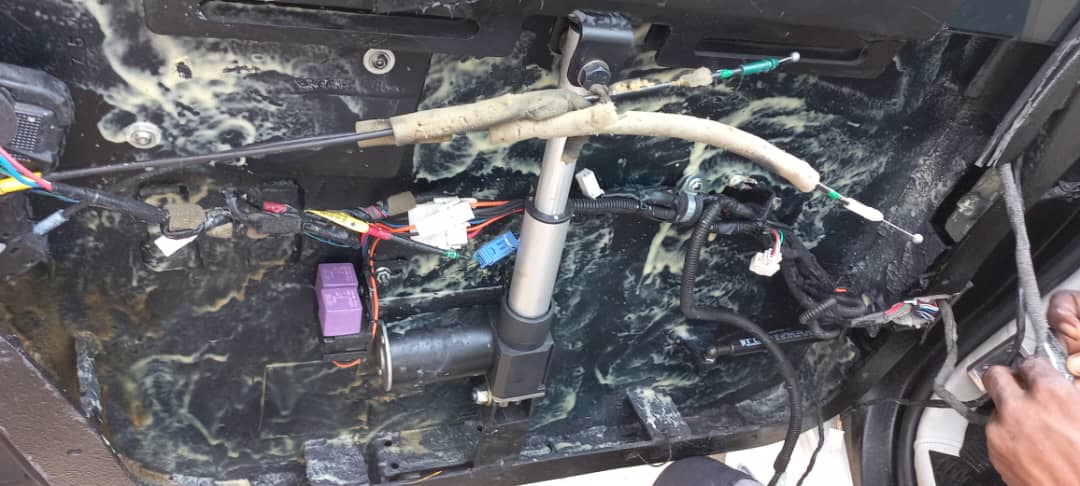 Under-seat wiring harness and relays exposed during repair