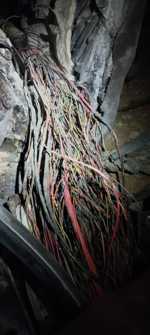 Severely damaged multi-colored vehicle wiring harness