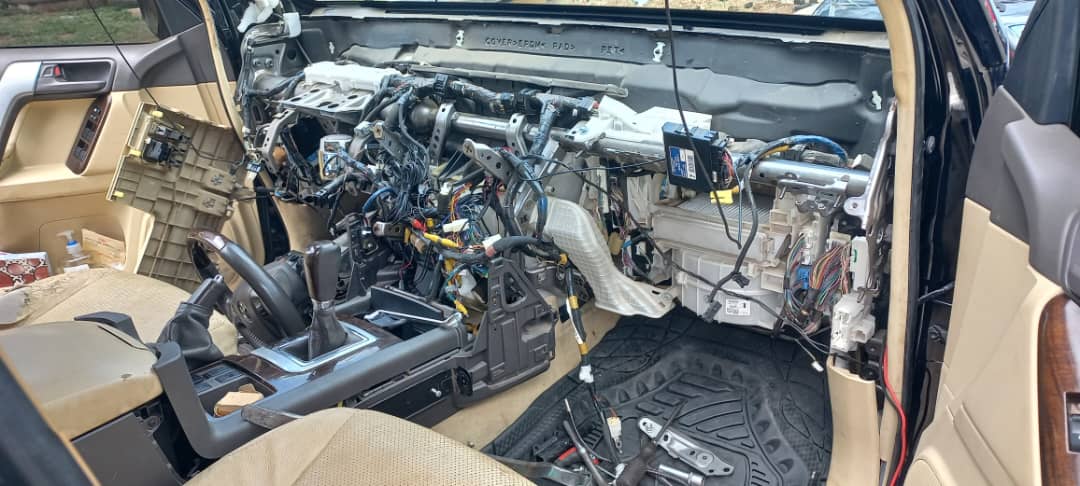 Vehicle dashboard removed exposing HVAC and steering column
